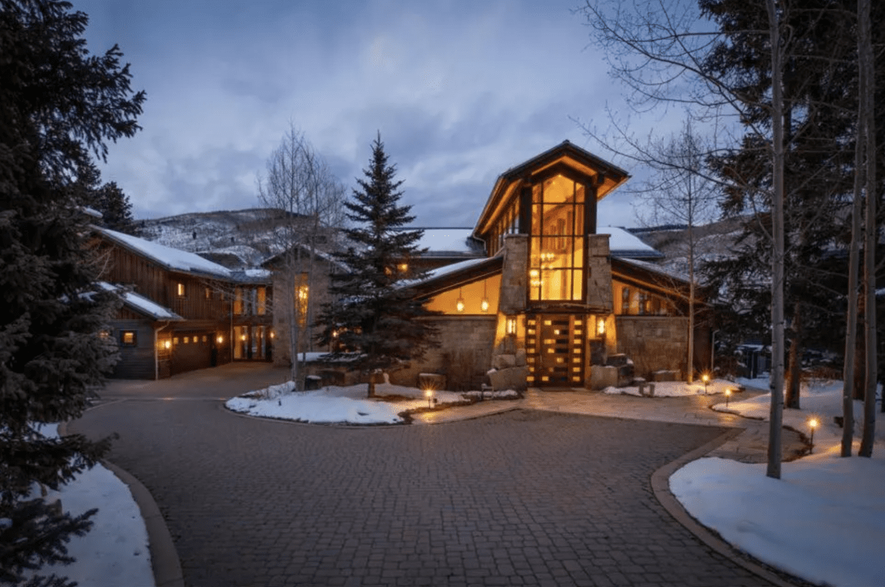 Dusk exterior image of luxury mountain home in for sale in the winter in Vail, Colorado.